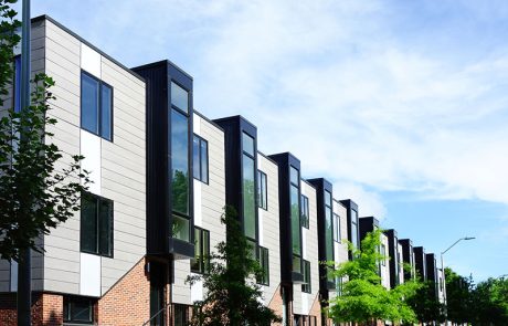 large apartment complex along streetside